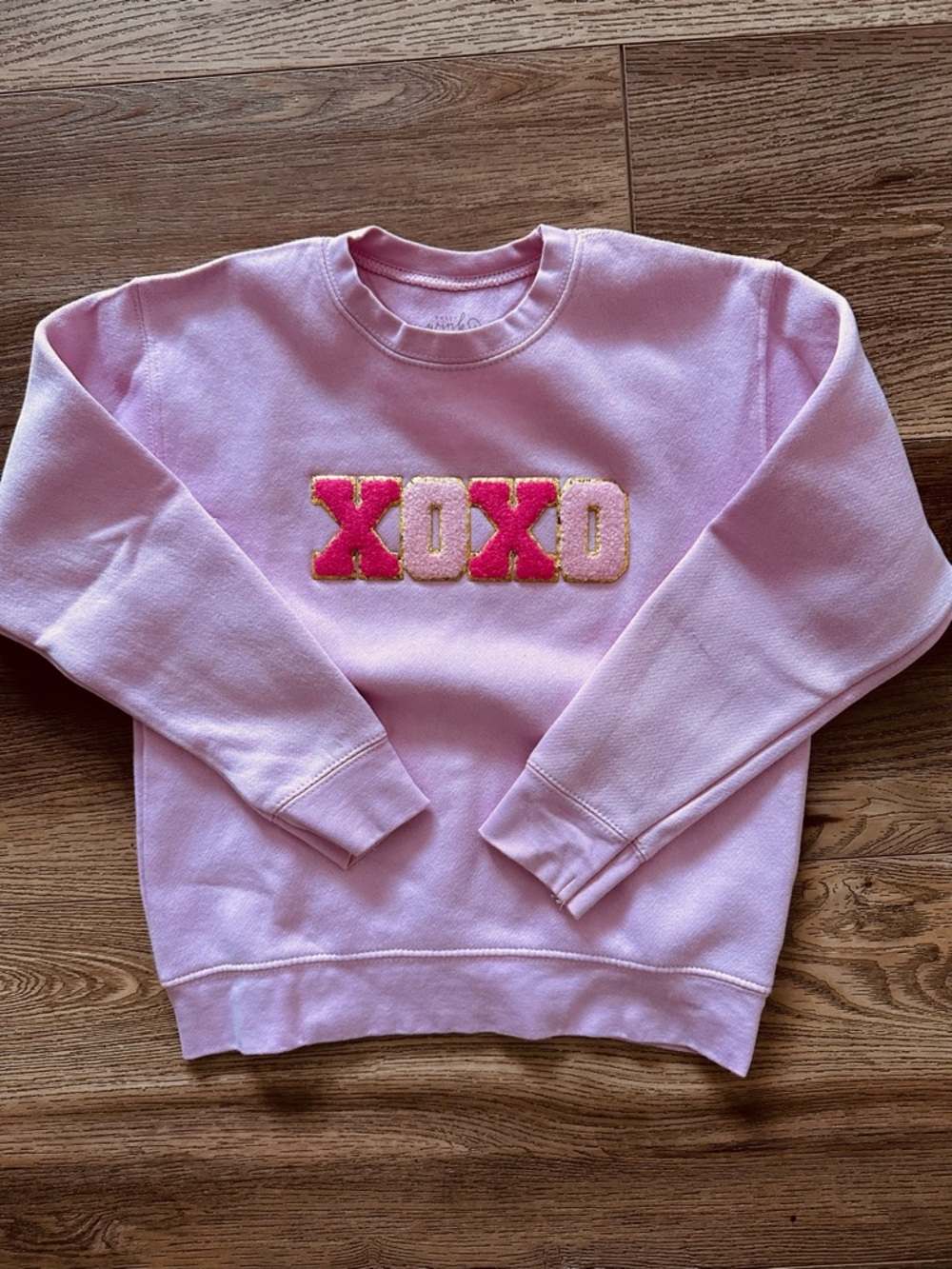 Wink Pink Crewneck Sweater with Gold-Edged XOXO Appliqué